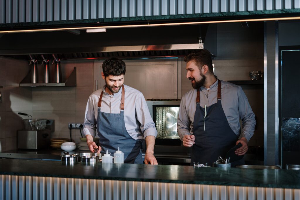 pexels-cottonbro-4253297 Two chefs cooking in commercial kitchen